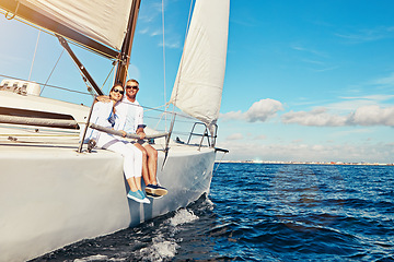 Image showing Sea, portrait and mature couple on a yacht for adventure, holiday freedom and sailing trip. Travel, summer and man and woman with sunglasses on a boat in ocean for romantic seaside holiday in Greece.