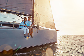 Image showing Holiday, relax and couple on a yacht in the ocean for adventure, freedom and sailing trip. Travel, summer and mature man and woman on a boat in the sea for a romantic seaside vacation in Greece.