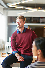 Image showing Man, business people and office with focus, learning and development of career for teamwork success. Modern office, woman and coworker sitting on table for marketing, team building or conversation