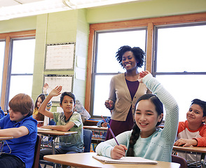 Image showing Education, teacher and kids raise their hands to ask or answer an academic question for learning. Diversity, school and primary school children speaking to their woman educator in the classroom.