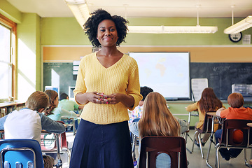 Image showing Portrait, teacher and black woman with students learning in classroom. Education, scholarship and happy, proud and young female educator with children ready for studying or knowledge in middle school