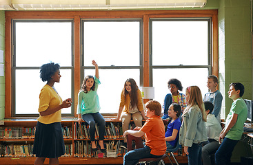 Image showing Education, learning and student with questions for teacher in middle school classroom. Library, scholarship group and girl learner raising hand to answer question, studying or help with black woman.