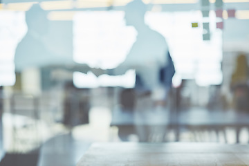 Image showing Through the window, business people and handshake for corporate deal, collaboration and partnership. Glass, blurry and staff talking, coworkers and gesture for welcome, greeting and meeting in office