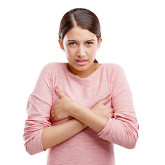 Image showing Portrait, breast cancer and holding chest with an indian woman in studio isolated on a white background. Health, medical and cancer with a sad young female on blank space to promote awareness