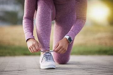 Image showing Runner, fitness and woman with sneakers outdoor for run, cardio and body training with health and wellness. Exercise, female start running and shoes with sports motivation and active lifestyle