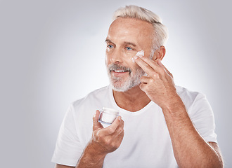 Image showing Skincare, beauty and face cream on senior man on white background for spa, wellness and dermatology. Cosmetics, grooming and elderly male with anti aging beauty products, facial treatment and lotion