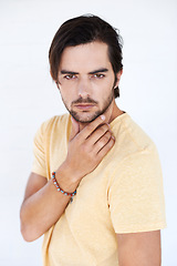 Image showing Idea, studio portrait and man thinking, focus and contemplating problem solving plan. Question, pensive doubt and puzzled model think of solution, decision or choice isolated on white background wall