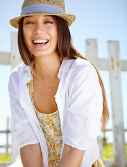 Image showing Happy woman, portrait and hat in sunshine, garden and outdoor park. Summer fashion, smile face and female at field fence, nature and freedom with happiness, relax and environment for holiday vacation