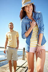 Image showing Portrait, date and summer with a couple on the promenade, walking together for romance or vacation. Nature, beach and blue sky with a man and woman enjoying a walk while bonding, dating or on holiday