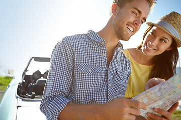 Image showing Road trip, travel and couple with map by car on summer holiday, vacation and weekend getaway by ocean. Adventure, freedom and happy man and woman reading paper for directions, navigation and journey