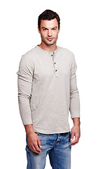 Image showing Portrait, face and man in studio isolated on a white background looking serious in casual clothes. Pride, cool and modern model male posing for trendy style with space for advertising and motivation