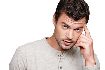 Image showing Thinking, fashion and portrait of man on a white background with trendy, stylish and casual clothes. Serious attitude and fashion model isolated in studio with confidence, ideas and thoughtful