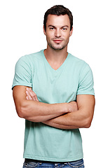 Image showing Portrait, smile and man with arms crossed in studio isolated on a white background looking happy. Pride, cool and modern model male posing in casual clothes for trendy style and positive mindset