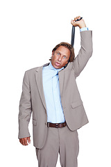 Image showing Depression, portrait and businessman hanging from tie, suicide and mens mental health isolated on white background. Anxiety, burnout and man frustrated in necktie with work, debt and stress in studio