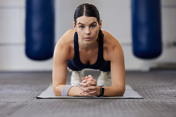 Image showing Fitness, woman and plank exercise in gym for wellness training, healthy lifestyle and workout. Portrait, focus and strong female athlete on elbow, floor and push up for sports, body muscle and power