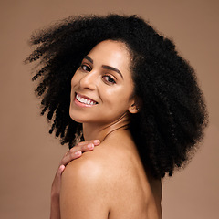 Image showing Woman, face skincare or afro haircare on brown studio background in self love, healthcare wellness or body dermatology. Portrait, smile happy or beauty model and natural hairstyle or makeup cosmetics