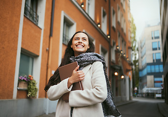 Image showing Travel, tourist and book with a sightseeing woman in the city traveling for tourism or vacation. Thinking, journal and traveling with a young female overseas or abroad for holiday in an urban town