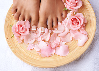 Image showing Pedicure, beauty and feet of a woman with flowers for cleaning, treatment and detox. Spa, dermatology and above foot of a model with a floral, cosmetic and natural grooming with roses for luxury