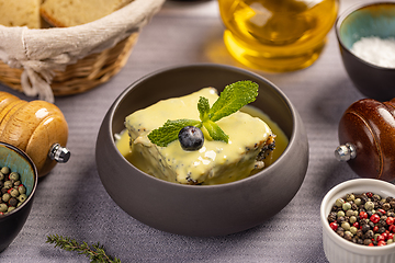 Image showing Poppy seeds cake topped with vanilla sauce