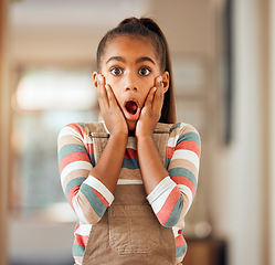 Image showing Little girl, hands and face in shock, surprise or wow for deal, discount or sale standing with expression at home. Portrait of female child, kid or toddler surprised or shocked for news at the house