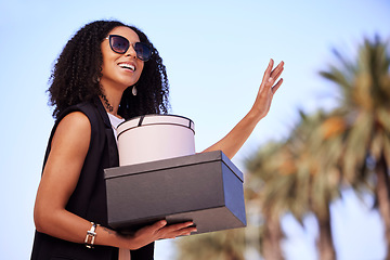 Image showing Black woman, shopping and gifts with smile waiting for lift, pickup or travel with fashion clothing in Miami. Happy African American female shopper smiling in happiness for purchase, sale or discount