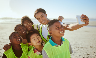 Image showing People, phone and selfie for eco friendly environment with smile at the beach for recycling in nature. Happy woman with kids smiling for photo by the sandy ocean looking at smartphone with vests