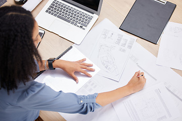 Image showing Above, woman and writing with documents, budget or planning in office with laptop, audit or financial goal. Black woman, accountant and paperwork for finance decision, strategy and focus at workplace