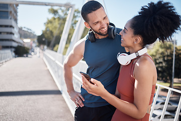 Image showing Fitness, exercise and black couple with phone in city for running, marathon training and workout on bridge. Love, sports and man and woman on smartphone for social media, music and health mobile app