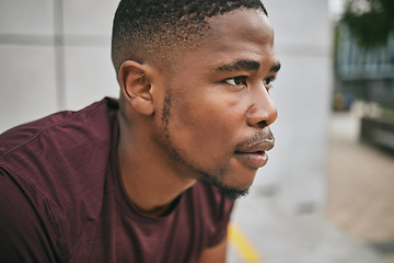 Image showing Face, fitness and exercise with a black man runner breathing alone outdoor in the city for cardio or endurance. Vision, motivation and workout with a male athlete training in an urban town for health