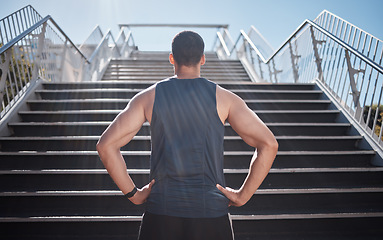 Image showing Fitness, man and stairs for sport in city for running, exercise or healthy cardio preparation. Muscular sporty male ready for training, workout or sports run for wellness by staircase in urban town