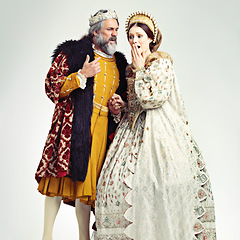 Image showing King, queen and surprised in medieval costume for royal party, retro carnival and theatre fashion clothes in white background. Couple, shocked face and vintage renaissance standing isolated in studio