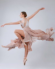 Image showing Woman dancing, ballet and studio background with balance, art movement and beauty for training. Professional dancer, performance and finesse in class with strong body, wellness and focus for concert