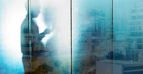 Image showing Glass, silhouette and businessman with city overlay in office, writing and thinking, goal and strategy. Double exposure, shadow and man entrepreneur planning, creative and motivation for innovation