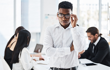 Image showing Leader black man, portrait and business people in meeting, discussion and glasses with leadership vision. Businessman, african and standing in office for teamwork, collaboration and corporate goals