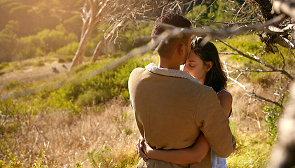 Image showing Nature, love and a couple hugging or kissing outdoor while sharing an intimate moment together in summer. Field, countryside and kiss with a man and woman bonding in sweet embrace outside with mockup