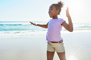 Image showing Kids, beach and dance with a black girl having fun alone on the sand in summer by the sea or ocean. Nature, Children and blue sky with a female child dancing by the water while on holiday or vacation