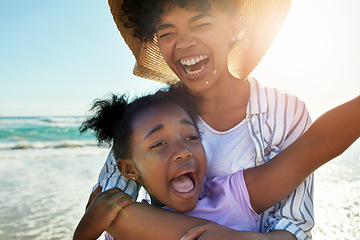 Image showing Family, children and beach with a mother and daughter laughing or joking together in the ocean or sea. Love, kids and coast with a black woman and girl having fun while bonding by the water in nature