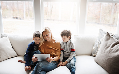 Image showing Tablet, home and mother with children on sofa bonding, quality time and relax on weekend together. Love, family and mom and kids with digital tech for online games, streaming movies and internet app