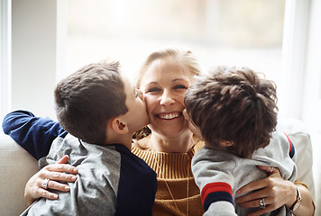 Image showing Kiss, happy and portrait of a mother with children for love, relax and bonding in a family home. Hug, smile and mom with affection for boy kids during quality time on the living room sofa of a house