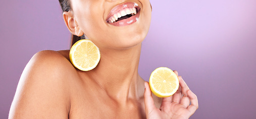 Image showing Woman, face skincare or lemon product on purple studio background for organic dermatology, healthcare diet wellness or self care grooming. Zoom, smile or happy beauty model and fruit facial cosmetics