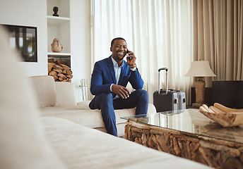 Image showing Happy businessman in hotel, on smartphone call and business communication for work in Atlanta. Young black entrepreneur, listening to audio on cellphone and sitting on luxury sofa in living room