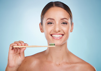 Image showing Brushing teeth, dental and woman with toothbrush for teeth whitening and beauty, oral health and fresh breath with studio background. Mouth wellness, Invisalign portrait and clean with bamboo brush.