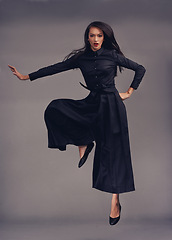 Image showing Portrait, woman and martial arts training, focus and female isolated on studio background. Lady, girl and ninja with traditional outfit, fitness and workout for practice, warrior and character in air