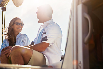 Image showing Couple sailing on yacht, summer and travel with vacation at sea, love and commitment with lens flare, sun and happiness. Man, woman and relationship, marriage and honeymoon in Italy with holiday