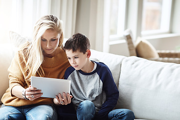 Image showing Tablet, love and mother with boy on sofa bonding, quality time and relax on weekend together. Family home, lifestyle and mom and kid with digital tech for online games, social media and internet app