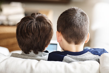 Image showing Kids, bonding or tablet for movies streaming, esports or social media on relax house sofa or home living room. Brothers, curious or children on digital technology in education learning or team gaming