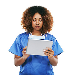 Image showing Black woman, doctor and tablet in studio for typing, focus or communication on internet by white background. Isolated nurse, touchscreen tech or reading social media app, article or science news