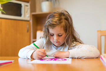 Image showing cute girl painting picture on paper