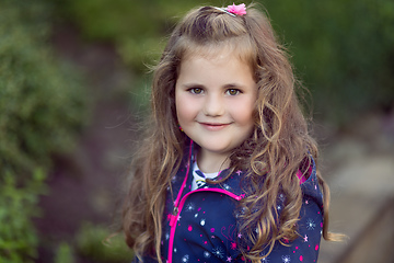 Image showing happy cute little girl with curly golden hair