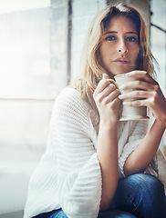 Image showing Coffee, portrait and woman relax in home with delicious cup of caffeine, espresso or cappuccino. Peace, tea and female with mug beverage sitting by window while enjoying quality time alone in house.